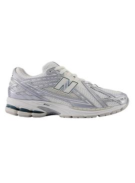 Sapatilhas New Balance 1906R prateadas e verdes para mulher.