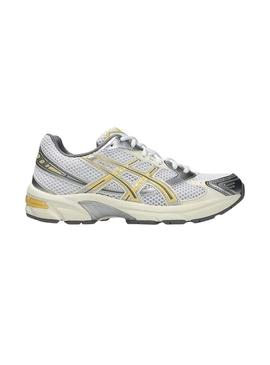 Sapatilhas Asics Gel 1130 amarelo e prateado para mulher.
