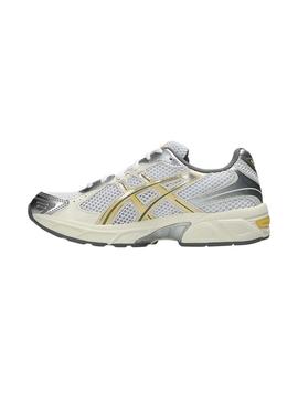 Sapatilhas Asics Gel 1130 amarelo e prateado para mulher.