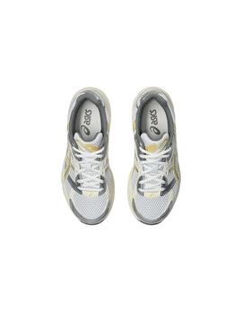 Sapatilhas Asics Gel 1130 amarelo e prateado para mulher.