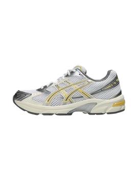 Sapatilhas Asics Gel 1130 amarelo e prateado para mulher.