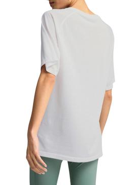 Camiseta Puma Evostripe branca para mulher.