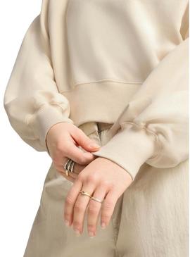 Blusa Puma Leo Luxe bege para mulher.