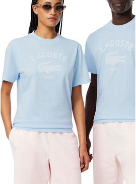 Camiseta Lacoste com estampa de logo azul para homens e mulheres.
