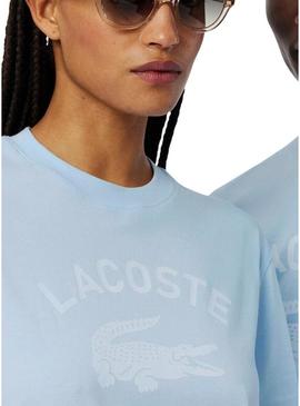 Camiseta Lacoste com estampa de logo azul para homens e mulheres.