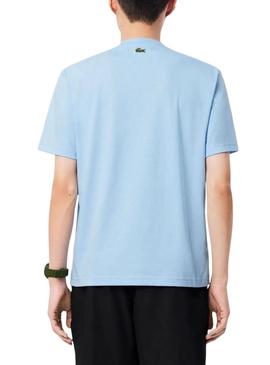 Camiseta Lacoste com logotipo esportivo azul para homem.