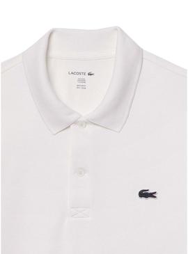 Camisa polo Lacoste branca com detalhes nas bordas para homem.