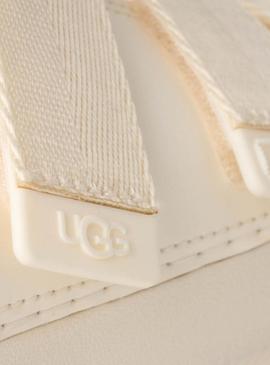 Sandálias UGG Goldenglow Slide bege para mulher.