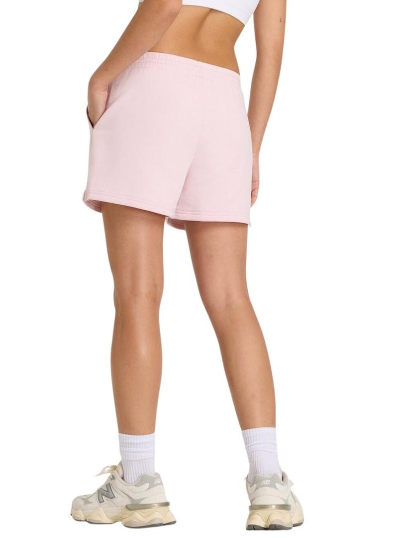Shorts New Balance Essentials French Terry rosa para mulher.