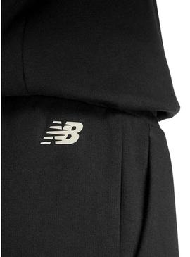 Calça New Balance Reimagined preta para mulher.