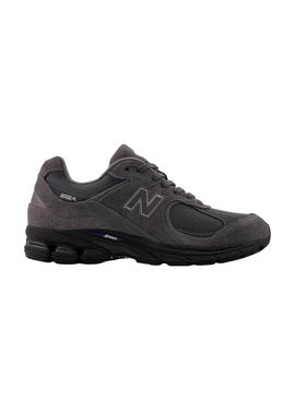 Sapatilhas New Balance U2002R roxas e pretas para homem.
