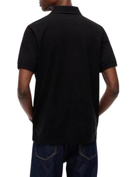 Camisa polo Tommy Jeans Essential preta para homem.