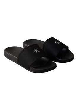 Sandálias Calvin Klein Jeans Slide Canvas preto para mulher.