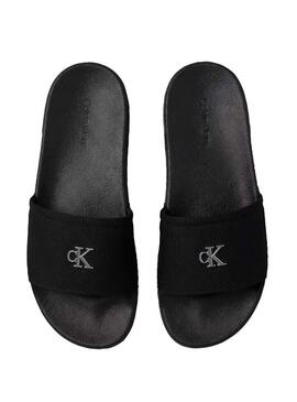 Sandálias Calvin Klein Jeans Slide Canvas preto para mulher.