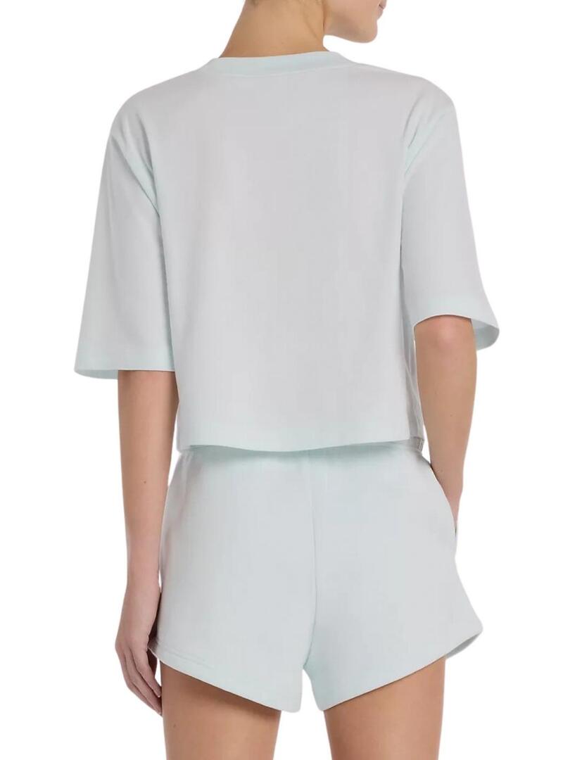 Camiseta New Balance oversize turquesa para mulher.